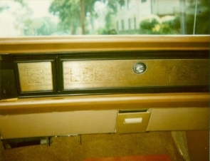 1970 Chrysler Newport Cordoba metal appliqu on glovebox and A/C outlet delete showing variations of the Aztec Eagle motiv.