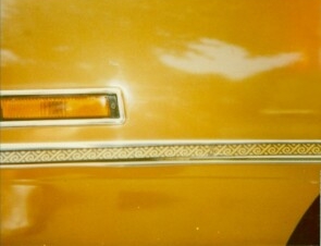 1970 Chrysler Newport Cordoba body side molding with Aztec appliqu